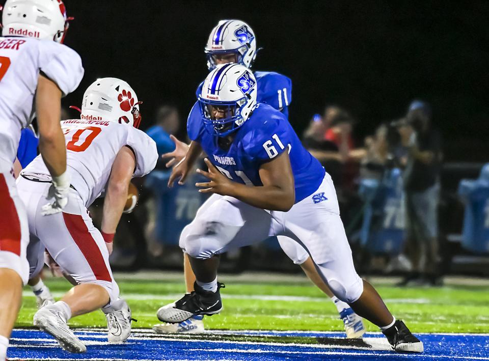 Offensive lineman Aba Selm, who committed to UK on Feb. 2, blocks during a high school football game on Sept. 10, 2021.