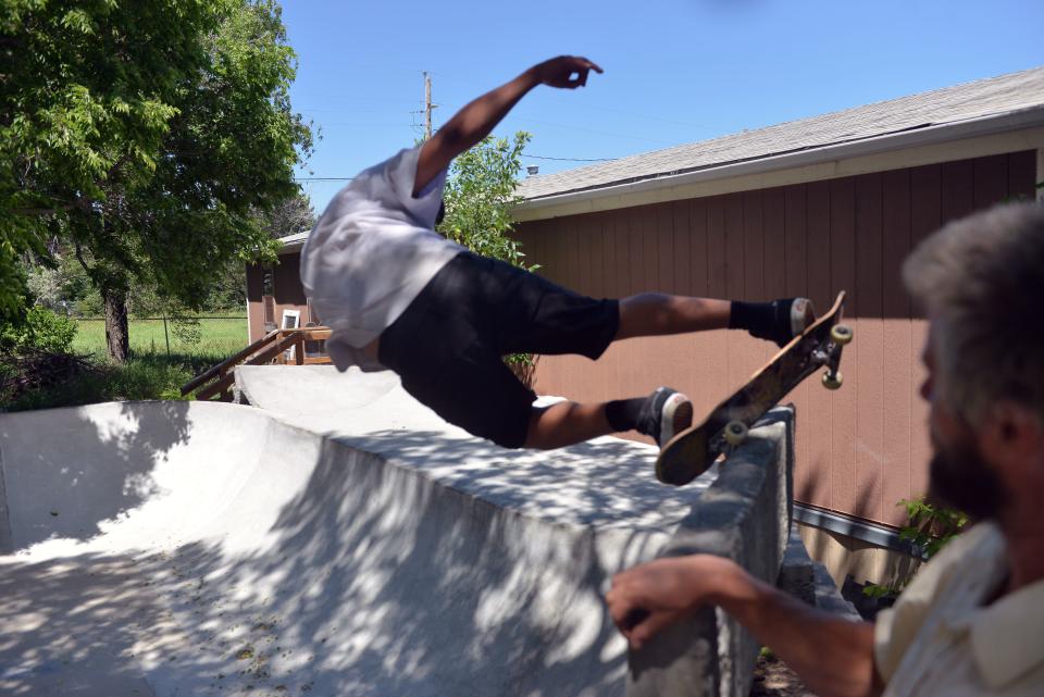 Dillon Two Eagle hits a trick on his skate park at the newest skatepark in Mission, South Dakota on Monday, June 19, 2023.