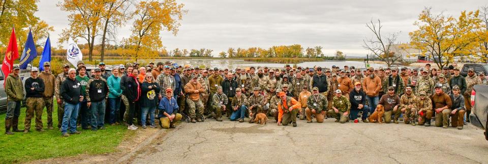 Military veterans and volunteers gather Oct. 21 in Horicon for a group photo at the 2023 Horicon Marsh Veterans Hunt.