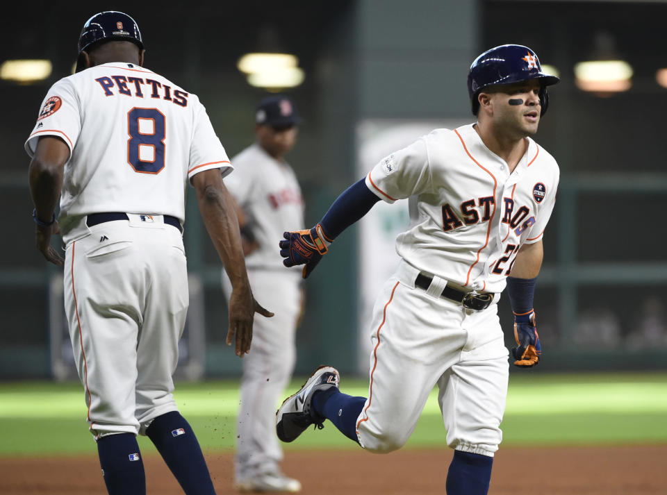 Houston Astros’ Jose Altuve (27) hit three home runs in Game 1 of the ALDS vs. Boston. (AP)