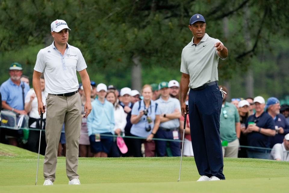 Tiger Woods, right, and Justin Thomas, left, prepare to putt on the seventh green during Tuesday's practice round for the 2023 Masters Tournament.