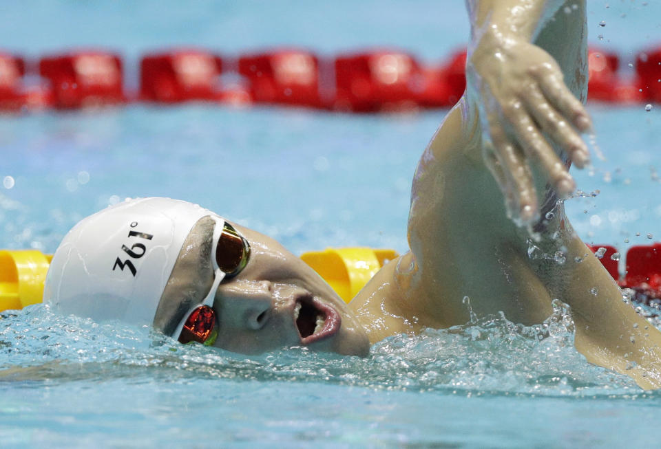 FILE - In this Thursday, July 25, 2019 file photo, China's Sun Yang swims during a warm up session at the World Swimming Championships in Gwangju, South Korea. Chinese swimmer star Sun Yang has been banned for more than four years for breaking anti-doping rules. The verdict by the Court of Arbitration for Sport ends Sun’s hopes of defending his Olympic title in the 200 meters freestyle in Tokyo next month. His ban expires in May 2024. (AP Photo/Mark Schiefelbein, File)