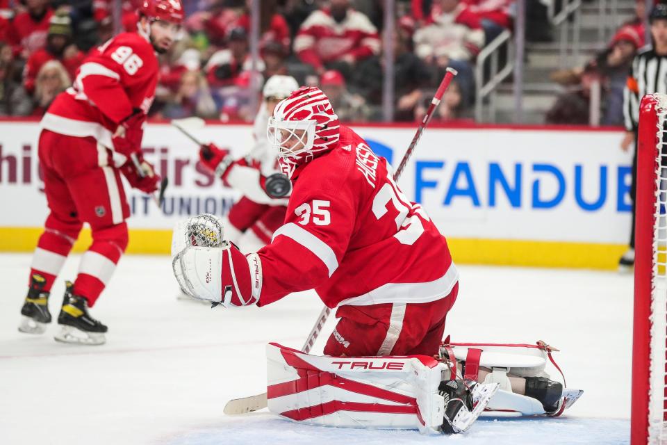 Detroit Red Wings goaltender Ville Husso (35) makes a save against the Carolina Hurricanes during the second period at Little Caesars Arena in Detroit on Thursday, Dec. 14, 2023.
