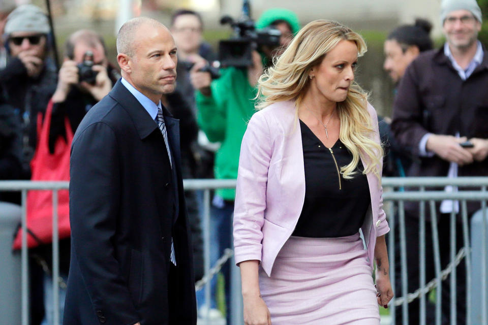 FILE- Adult film actress Stormy Daniels, accompanied by her attorney, Michael Avenatti, left, walk away after speaking to the media outside federal court, on April 16, 2018, in New York. Avenatti, the once high-profile California attorney who regularly taunted then-President Donald Trump during frequent television appearances, was introduced Thursday, Jan. 20, 2022, to prospective jurors who will decide whether he cheated porn star Stormy Daniels out of book-deal proceeds. (AP Photo/Seth Wenig, File)