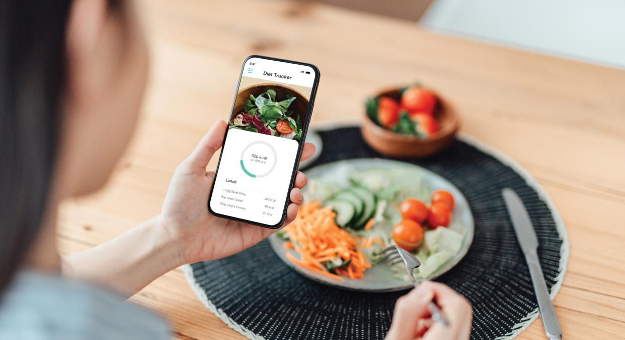 Woman tracking diet on phone