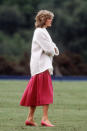 <p>Today, chunky jumpers worn with midi skirts are a transseasonal go-to, but Diana was wearing the outfit combo decades ago. <em>[Photo: PA]</em> </p>