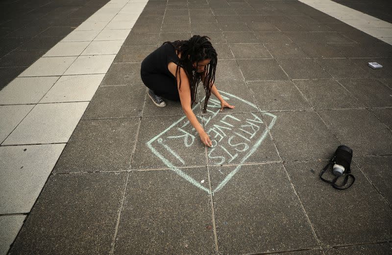A performing artist writes a message protesting the lack of financial support for the arts in Cape Town