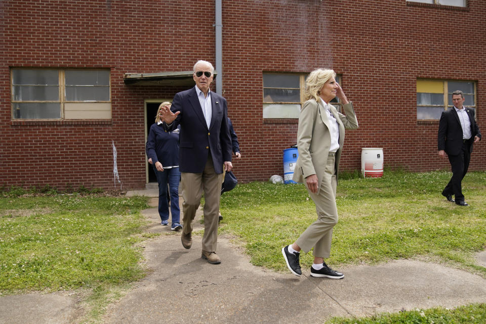 President Joe Biden waves as he and first lady Jill Biden arrive to meet with those impacted by last week's severe storm in Rolling Fork, Miss., Friday, March 31, 2023. A deadly tornado destroyed homes and businesses in Rolling Fork, and the nearby town of Silver City. (AP Photo/Carolyn Kaster)