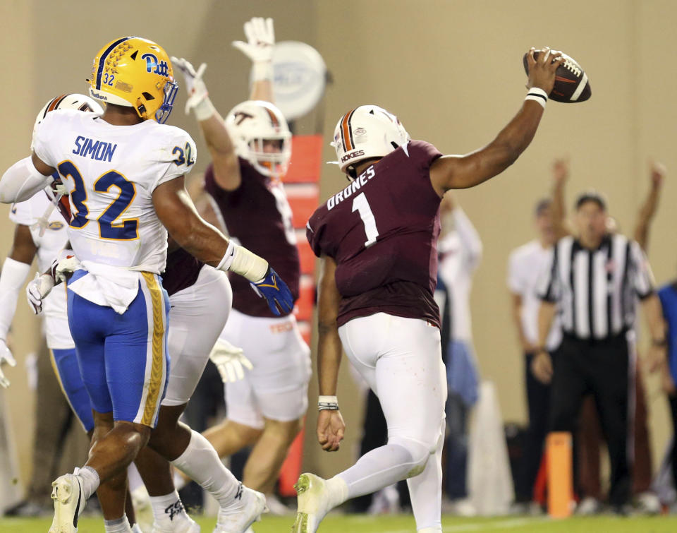 Virginia Tech quarterback Kyron Drones (1) scores against Pittsburgh during the first half of an NCAA college football game Saturday, Sept. 30, 2023, in Blacksburg, Va. (Matt Gentry/The Roanoke Times via AP)