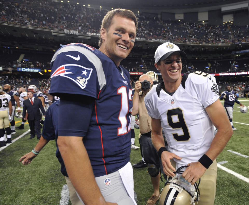 FILE - In this Aug. 22, 2015, file photo, New England Patriots quarterback Tom Brady (12) and New Orleans Saints quarterback Drew Brees (9) greet each other after an NFL preseason football game in New Orleans. Between them, Brady and Brees have played 38 pro football seasons, 39 if you count 2008 when the New England star wrecked his knee in Week 1, and could be doing so against each other on Feb. 2 in a little thing called the Super Bowl. (AP Photo/Bill Feig. File)