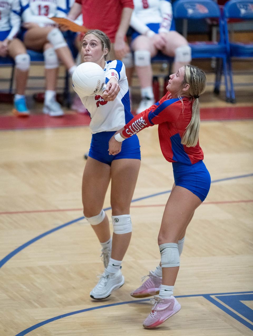 Ashlyn Hines (23) and Lily Sutton (1) plays the ball during the West Florida vs Pace volleyball match at Pace High School on Wednesday, Sept. 6, 2023.