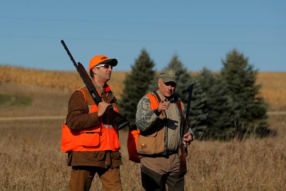 Donald Trump Jr. (L) walks with Rep. Steve King (R-IA) after the Colonel Bud Day memorial pheasant hunt near Akron, Iowa, U.S., October 28, 2017.