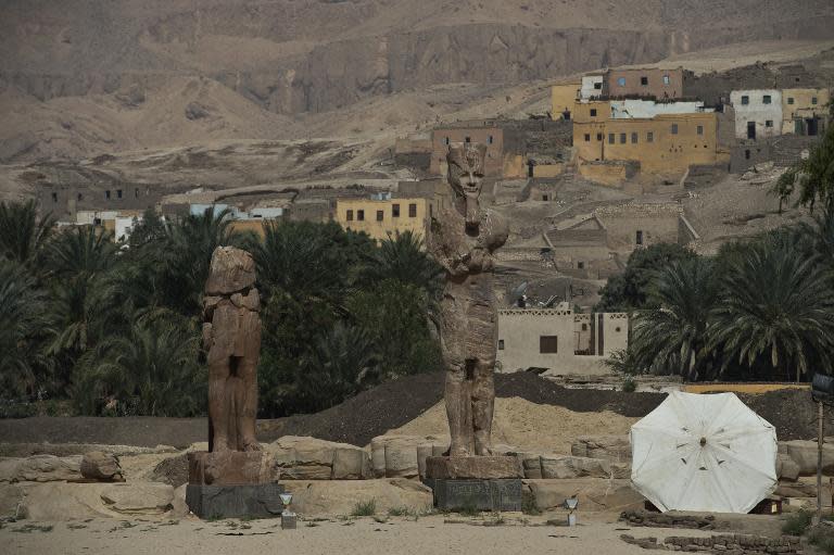 Statues of pharaoh Amenhotep III are unveiled in Egypt's temple city of Luxor on March 23, 2014