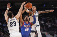 Villanova forward Tyler Burton (23) and guard Justin Moore, right, guard DePaul forward Jeremiah Oden during the second half of an NCAA college basketball game in the first round of the Big East Conference tournament, Wednesday, March 13, 2024, in New York. (AP Photo/Mary Altaffer)