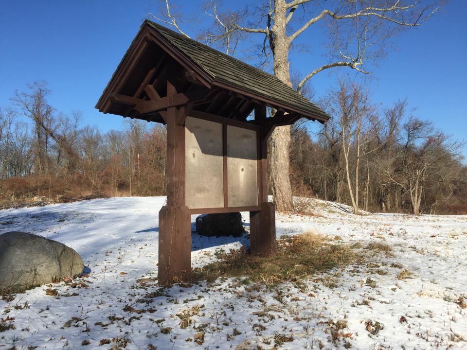 A wooden map kiosk goes unused at the entrance of Donald J. Trump State Park’s French Hill section. (Photo: Michael Walsh/Yahoo News)