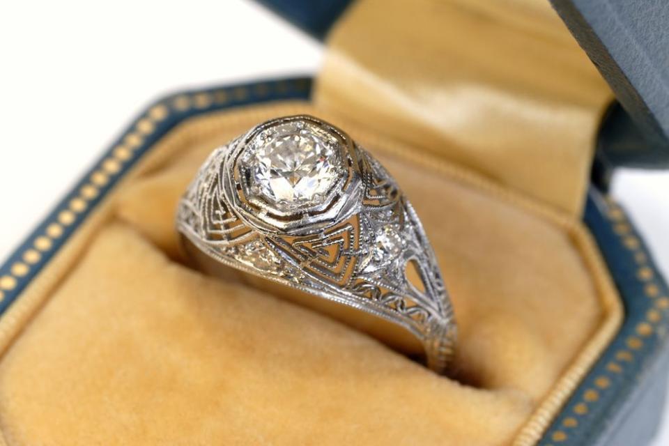 <p>Engagement rings arrived in America in the 1840s but were still relatively uncommon. In the Edwardian era (1901–1910), designs were marked by their dainty and elaborate details. Most rings centered around a large diamond and the goal of the jeweler was to get as many diamonds on the piece as possible. They would do so by encrusting small diamonds into settings made of filigree and ornate detailing sometimes resembling lace. </p>