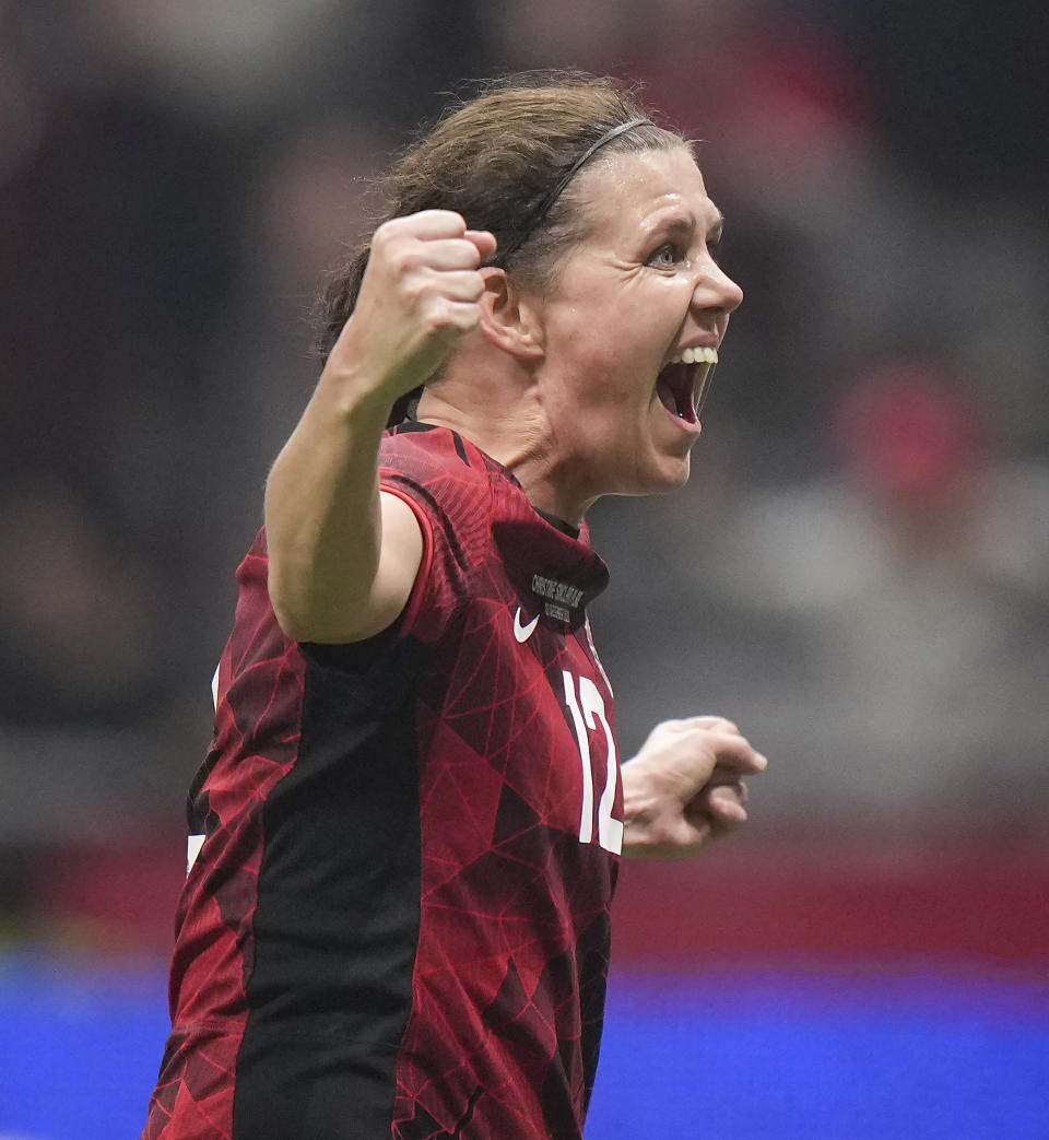 Canada's Christine Sinclair celebrates a goal by teammate Quinn against Australia during the first half of an international friendly soccer match Tuesday, Dec. 5, 2023, in Vancouver, British Columbia. (Darryl Dyck/The Canadian Press via AP)