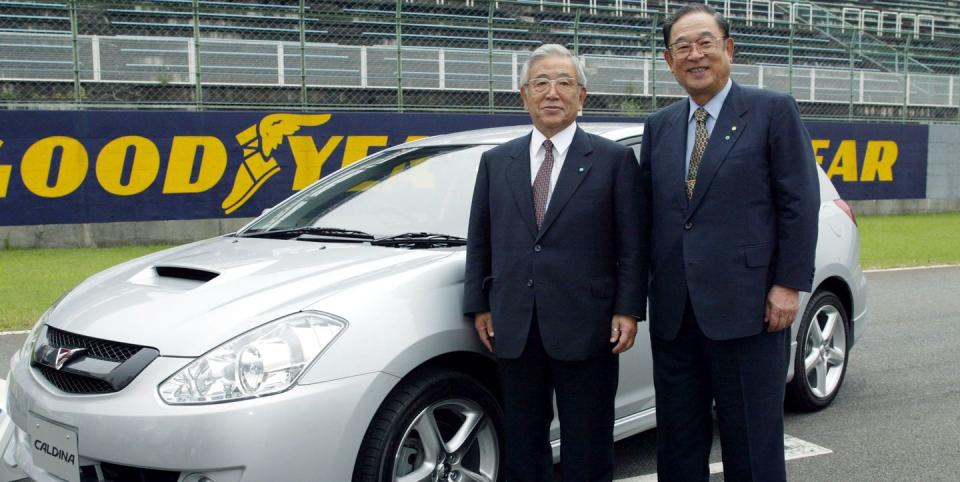 shoichiro toyoda at left pictured with toyota ceo fujio cho in 2002 and toyota's new caldina wagon