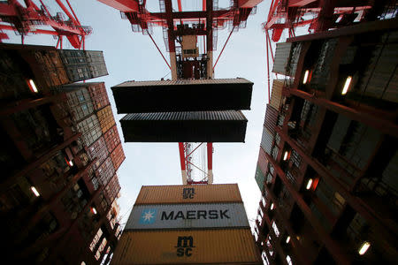 Containers are seen unloaded from the Maersk's Triple-E giant container ship Maersk Majestic, one of the world's largest container ships, at the Yangshan Deep Water Port, part of the Shanghai Free Trade Zone, in Shanghai, China, September 24, 2016. REUTERS/Aly Song/File Photo