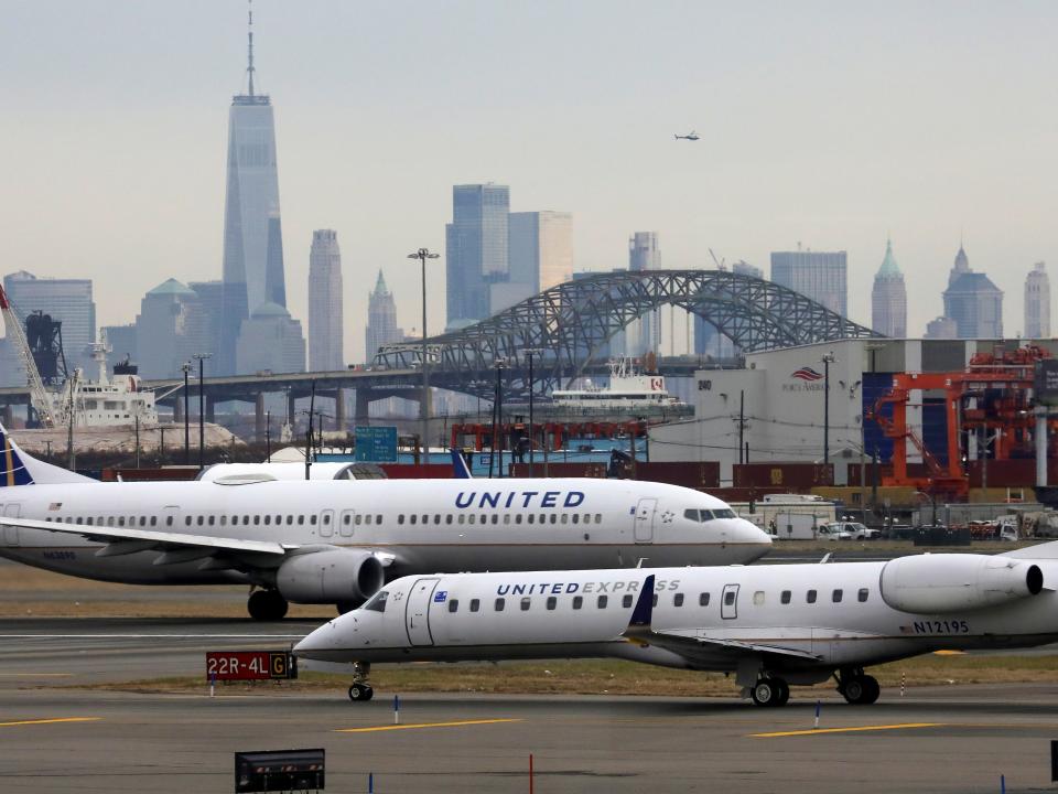 FILE PHOTO: United Airlines passenger jets taxi with New York City as a backdrop, at Newark Liberty International Airport, New Jersey, U.S. December 6, 2019. REUTERS/Chris Helgren