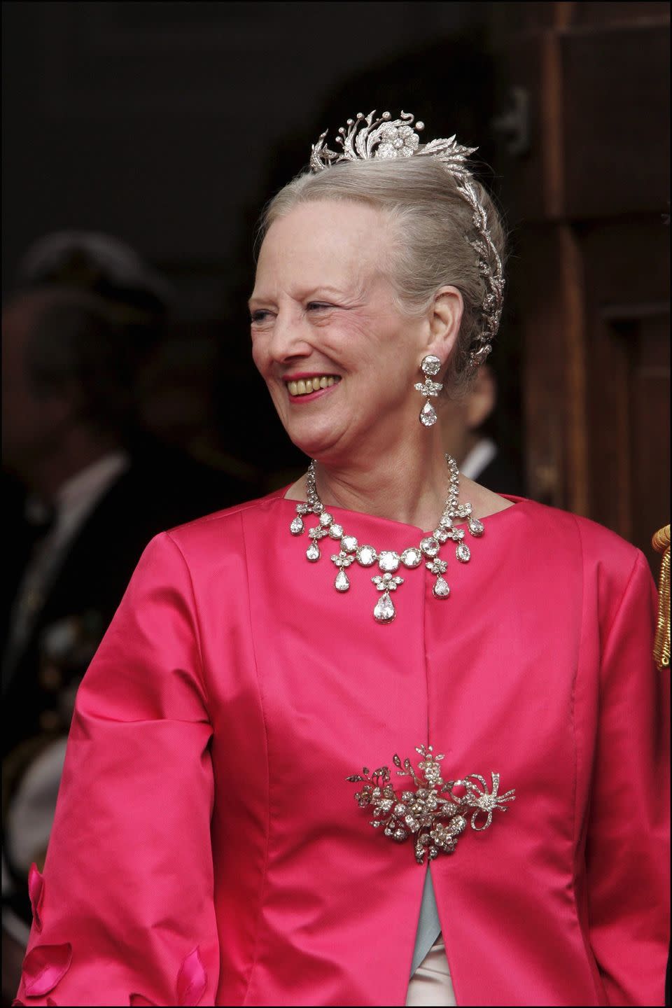 <p>Margrethe opted for a bold pink outfit for the wedding of her son Prince Frederik to Mary Donaldson, the future Princess Mary. According to <em><a href="https://www.thecourtjeweller.com/2021/04/queen-margrethe-iis-royal-tiaras.html" rel="nofollow noopener" target="_blank" data-ylk="slk:the Court Jeweller" class="link ">the Court Jeweller</a></em>, this avant-garde tiara was made for her in 1976 by Arje Griesgst.</p>