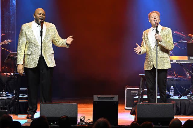 <p>Paras Griffin/Getty</p> Ruben Studdard (left) and Clay Aiken performing in Atlanta in January
