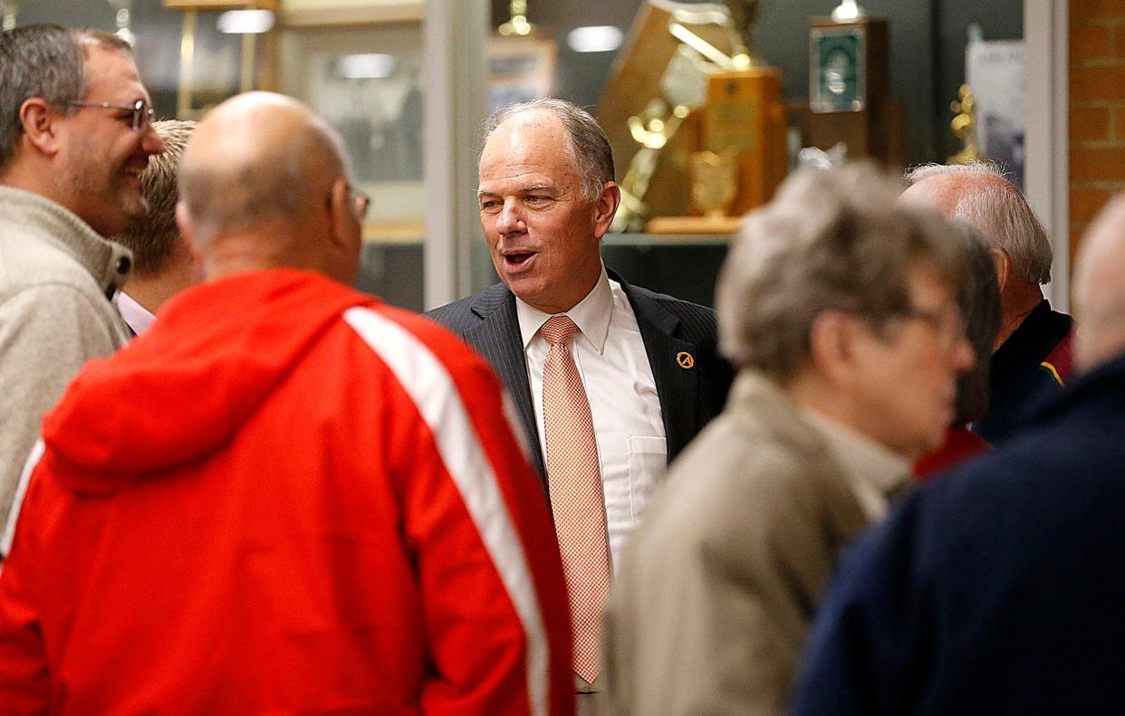 Then-superintendent of Ashland City Schools Doug Marrah talks with guests at the reception for his retirement at the end of 2022.