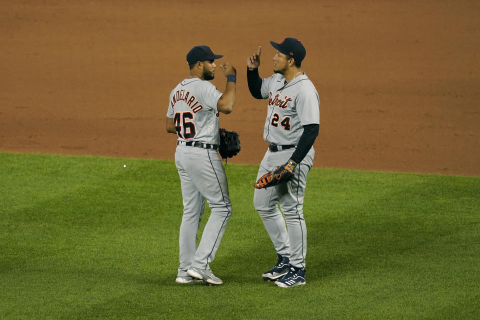 Detroit Tigers' Miguel Cabrera (24) and Jeimer Candelario (46) celebrate after their baseball game against the Kansas City Royals Friday, May 21, 2021, in Kansas City, Mo. The Tigers won 7-5. (AP Photo/Charlie Riedel)