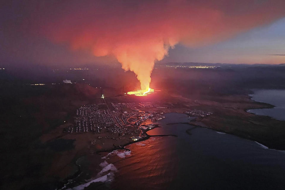 In this photo provided by Civil Protection taken from the Icelandic Coast Guard's helicopter, a view of lava as the volcano erupts near Grindavík, Iceland, Sunday, Jan. 14. 2024. A volcano has erupted in southwestern Iceland, sending semi-molten rock spewing toward a nearby settlement for the second time in less than a month. Iceland's Icelandic Meteorological Office says the eruption Sunday came after a swarm of earthquakes near the town of Grindavik. (Icelandic Civil Protection via AP)