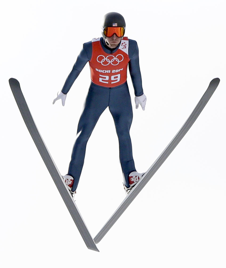 Taylor Fletcher of the United States soars through the air during a men's nordic combined training session in the ski jumping stadium at the 2014 Winter Olympics, Monday, Feb. 10, 2014, in Krasnaya Polyana, Russia. (AP Photo/Matthias Schrader)