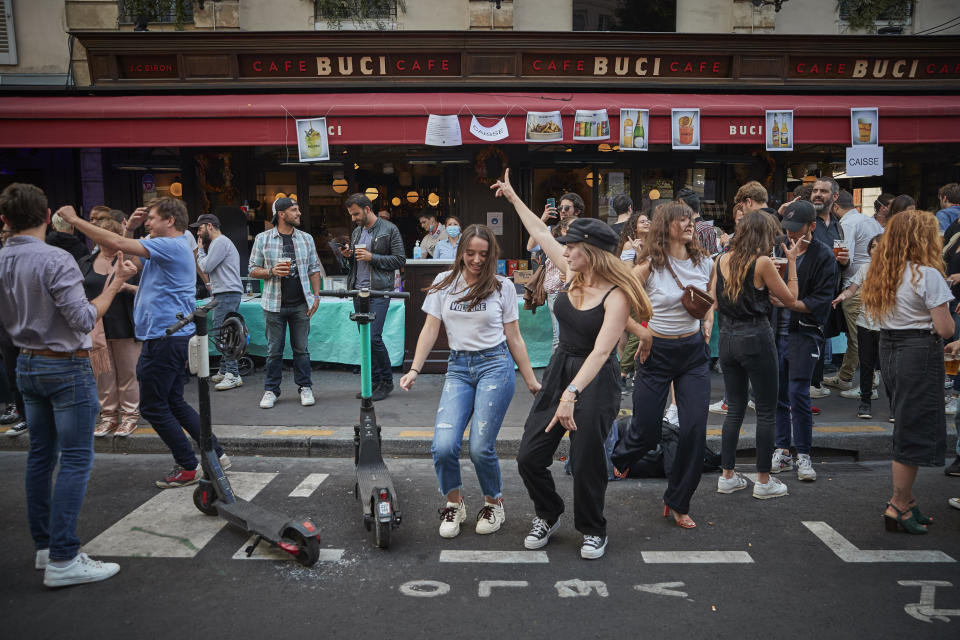 Parisians dance in the street in the 6th Arrondissement as Paris celebrates the first day of summer with Fete de La Musique with bands playing across the city on June 21. (Photo: Kiran Ridley via Getty Images)