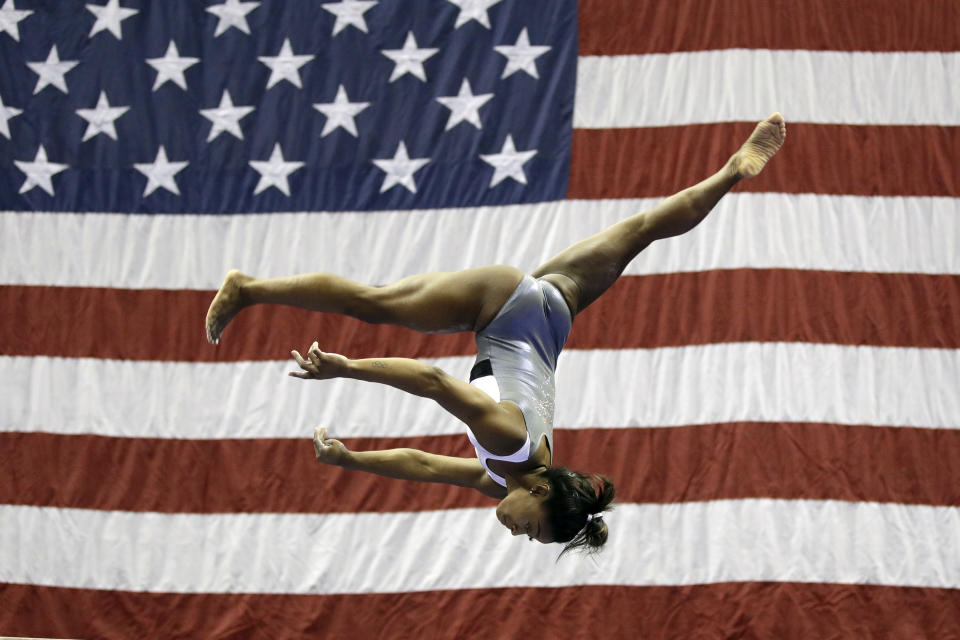 Simone Biles works on the beam during practice for the U.S. Gymnastics Championships Wednesday, Aug. 7, 2019, in Kansas City, Mo. (AP Photo/Charlie Riedel)