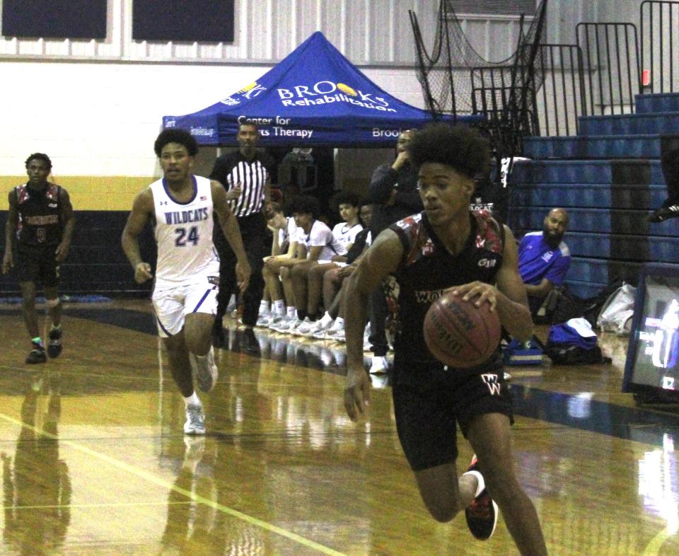 Westside and Pensacola Washington face off during the MLK Showcase boys basketball tournament on Monday. The annual tradition completed its 24th year.