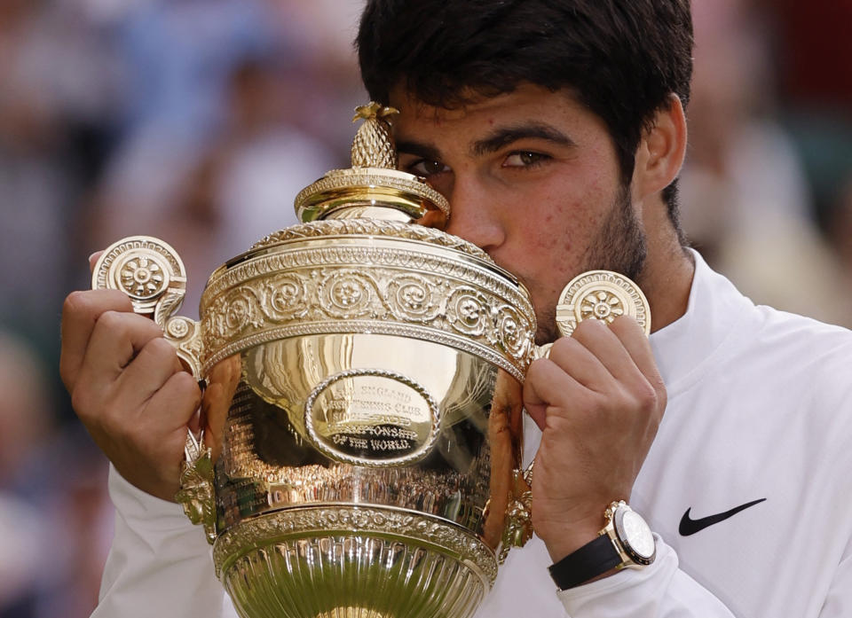 Spain's Carlos Alcaraz celebrates with the trophy after winning his final match against Serbia's Novak Djokovic at Wimbledon (Reuters via Beat Media Group subscription)