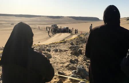 Monks look at the view following a gunmen attack against a group of Coptic Christians travelling to a monastery in southern Egypt, in Minya, May 26, 2017. REUTERS/Mohamed Abd El Ghany