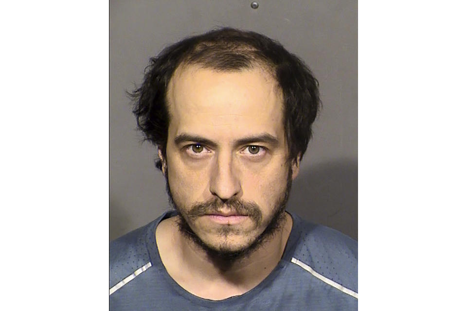 This booking photo released by the Las Vegas Metropolitan Police Department shows suspect Michael Sanchez, 37, after he was arrested in Las Vegas on Sunday, Jan. 29, 2023. Sanchez, accused of telephoning threats to “shoot up” a Southern Nevada synagogue, made an initial court appearance Wednesday, Feb. 1, 2023, in Las Vegas. He faces a felony charge of threatening an act of terrorism. He was not asked to enter a plea, pending a preliminary hearing of evidence scheduled for Feb. 15. (Las Vegas Metropolitan Police Department via AP)