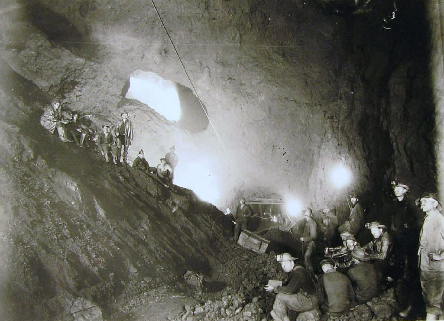 In this undated photo, a class from the Michigan College of Mines holds a session within an iron mine. (Courtesy Michigan Technological University)