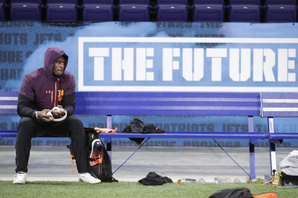 Mississippi wide receiver D.K. Metcalf sits on the bench between drills at the NFL football scouting combine in Indianapolis, Saturday, March 2, 2019. (AP Photo/Michael Conroy)