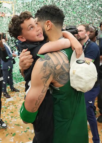 <p>Jesse D. Garrabrant/NBAE/Getty</p> Jayson Tatum celebrates during the game against the Dallas Mavericks during Game 5 of the 2024 NBA Finals on June 17, 2024.