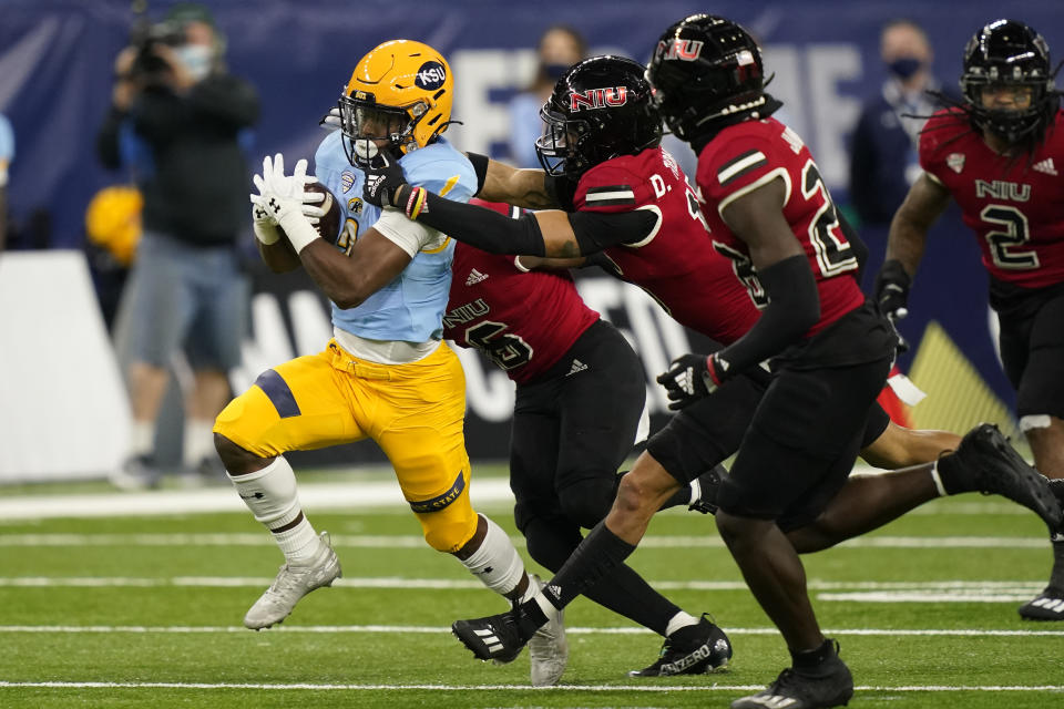 Kent State running back Xavier Williams rushes during the first half of an NCAA college football game against Northern Illinois, Saturday, Dec. 4, 2021, in Detroit. (AP Photo/Carlos Osorio)