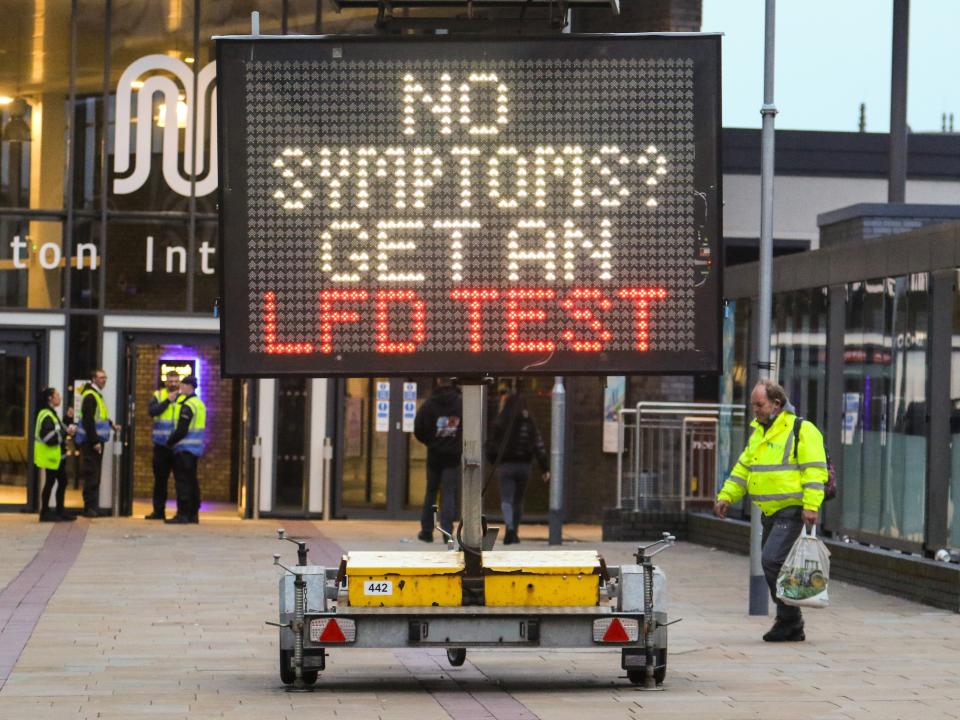 <p>A sign urging residents of the northwest town to get tested</p> (Phil Taylor / SWNS)