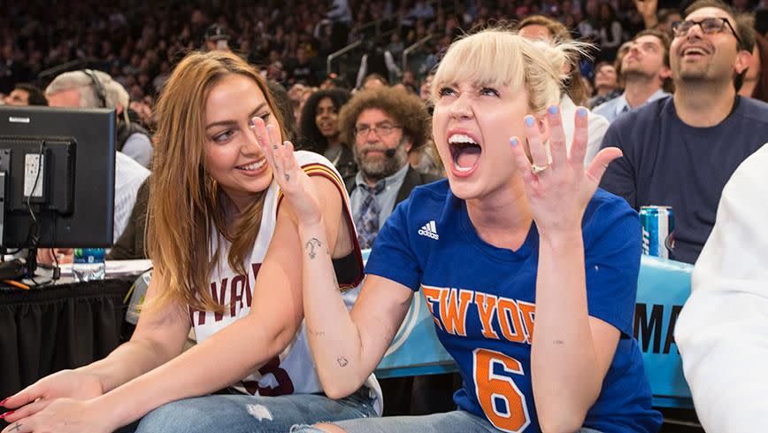 Miley Cyrus and her sister Brandi. Photo: Getty