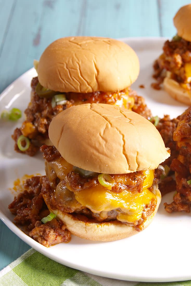 <p>These are saucy and SO cheesy.</p><p>Get the recipe from <a href="https://www.delish.com/cooking/recipe-ideas/recipes/a48951/chili-cheese-burgers-recipe/" rel="nofollow noopener" target="_blank" data-ylk="slk:Delish;elm:context_link;itc:0;sec:content-canvas" class="link ">Delish</a>.</p>