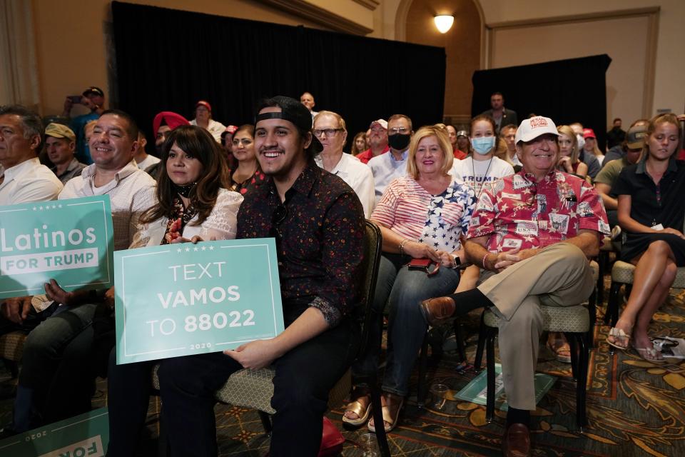 The crowd listens to President Donald Trump speak as he participates in a Latinos for Trump Coalition roundtable Monday, Sept. 14, 2020, in Phoenix. (AP Photo/Ross D. Franklin)