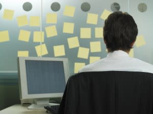 Person sits in front of blank post-its