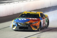Kyle Bush pulls into pit row with 30 laps to go in the NASCAR Southern 500 auto race Sunday, Sept. 4, 2022, in Darlington, S.C. Jones held on to the victory after taking the lead from Kyle Busch, who blew a motor with 30 laps remaining pin the race. (AP Photo/Sean Rayford)