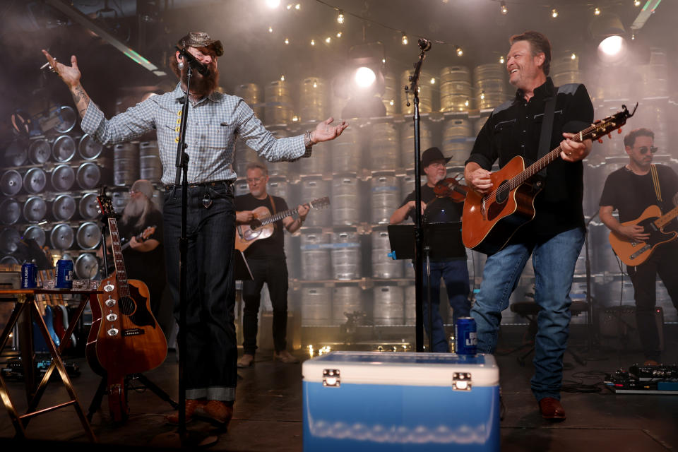 Malone and Blake Shelton perform onstage.