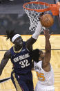 New Orleans Pelicans forward Wenyen Gabriel (32) blocks a shot by Orlando Magic guard Chasson Randle (25) during the second half of an NBA basketball game Thursday, April 22, 2021, in Orlando, Fla. (AP Photo/Phelan M. Ebenhack)