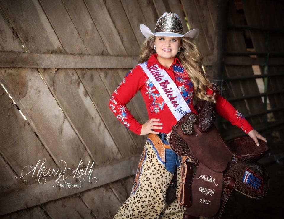 Mary Ivey with her National Little Britches Rodeo Association saddle, sash and hat commemorating her Rodeo Queen nomination.