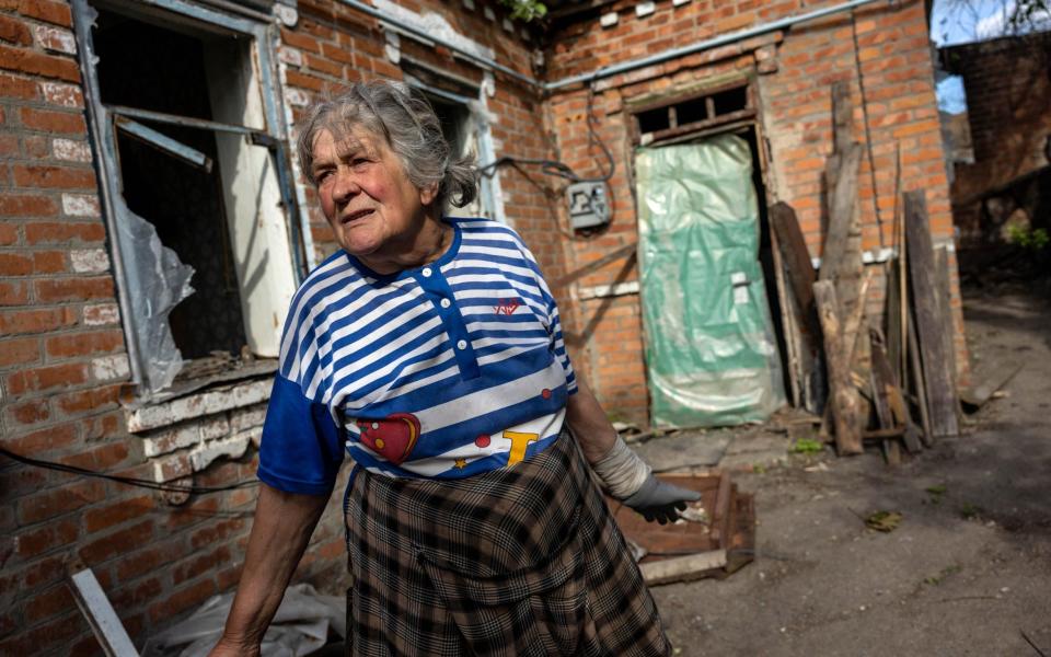 Kateryna Kostiantynivna walks through her shattered home while recalling first week of the Russian invasion - John Moore/Getty Images